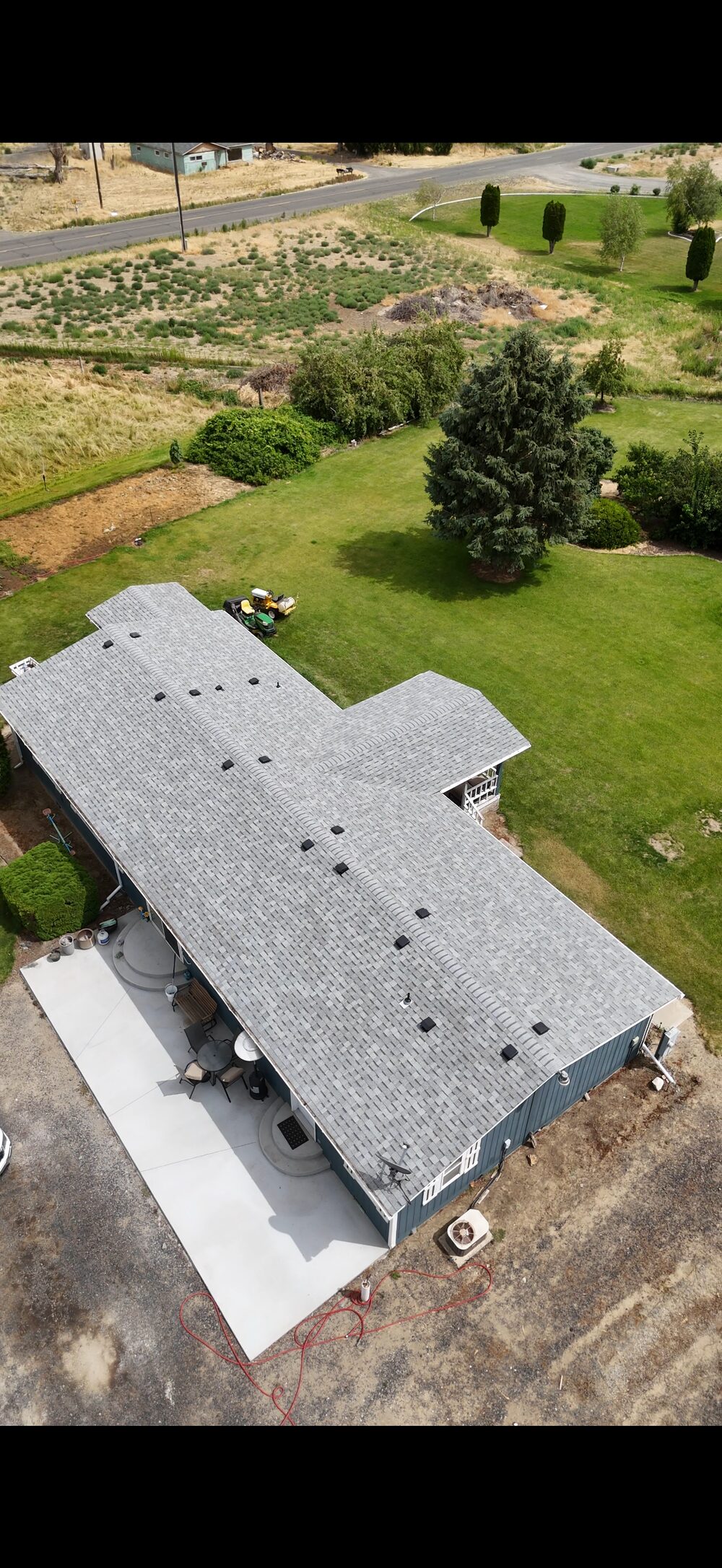 Finished light grey shingle roof, aerial view