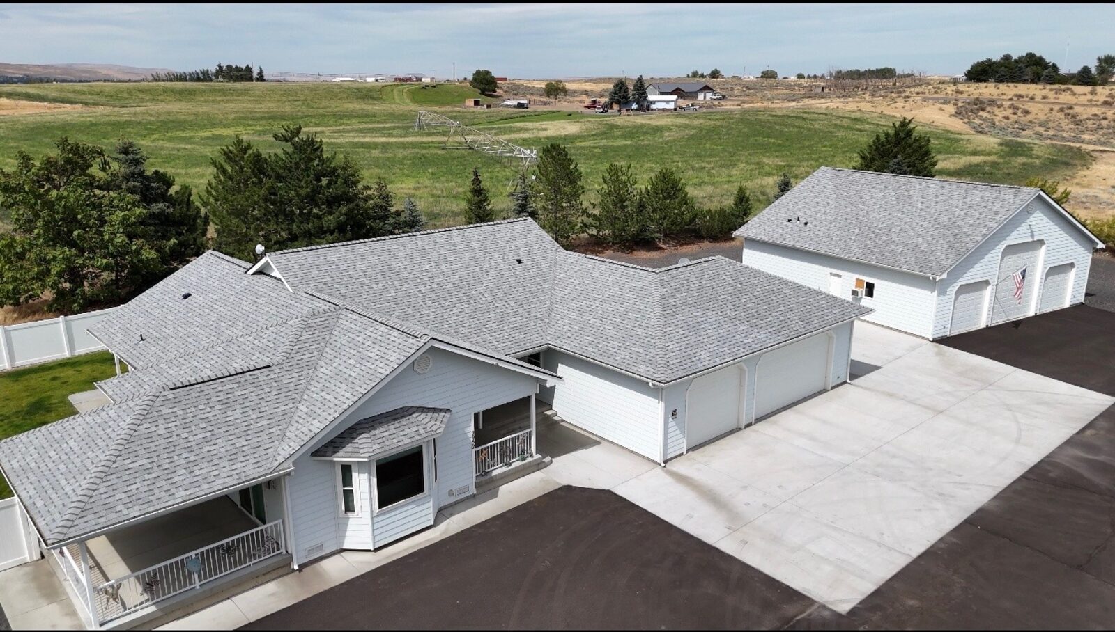 Finished architectural shingle roof on home and shop