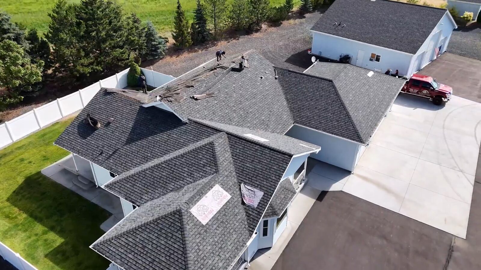 Crew tearing off old shingles
